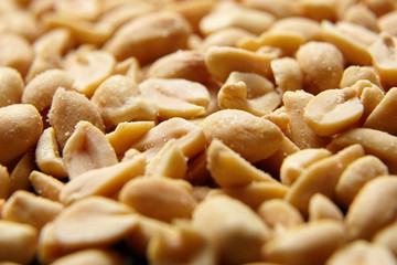 Beer snack. Salty roasted peeled peanuts closeup