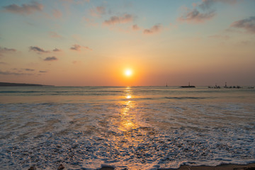 Beautiful sunset scenery at Jimbaran beach, Bali island, Indonesia.