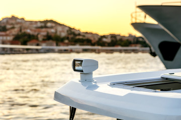Yacht's signal headlight on the white board