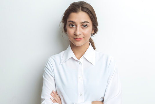 Portrait Of A Business Indian Woman On A White Background. Smiling Girl Student.