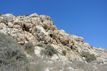 bottom up view of the mountain and cloudless summer sky