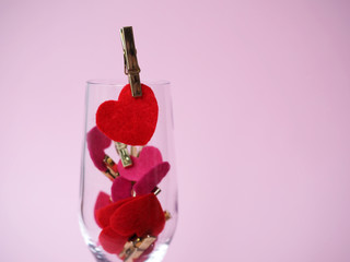 Valentine's Day. champagne glass filled with hearts
