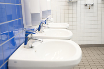 a row of sinks in a public washroom