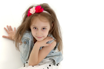 The little girl folded her hands around her face.