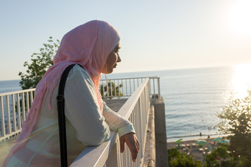 Muslim girl on sea coast