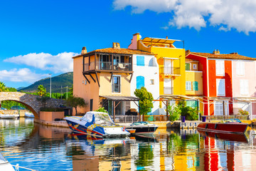 Obraz premium View Of Colorful Houses And Boats In Port Grimaud During Summer Day-Port Grimaud, France