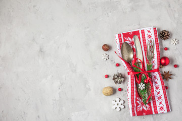 Christmas food background. Cutlery set for Christmas dinner with holiday decorations on concrete table. top view