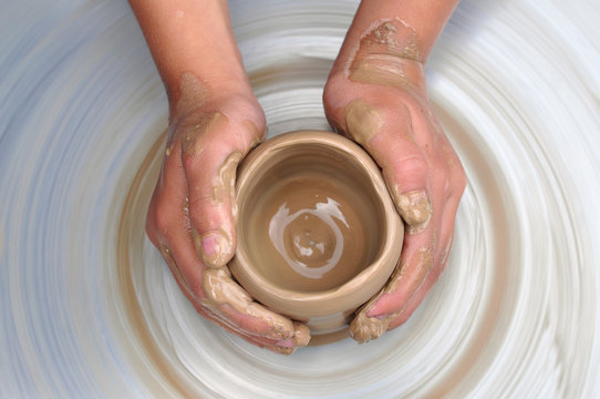 Hands Of Potter Creating A Jar