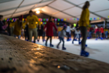 Obraz premium Children ice skating in winter time. Blurry background