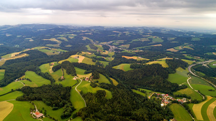 Naklejka premium Aerial view Gemeinde Zobern. Aspang-Markt is market town in Lower Austria. Bucklige Welt is region in southeast Austria. Land of thousand hills Bucklige Welt is hill country area eastern edge of Alps.