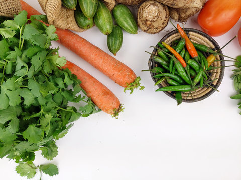 Indian vegetables of Tomatoes, Yams, Pointed gourd, Green chilies, Methi leaves, cilantro, and egg plants.
