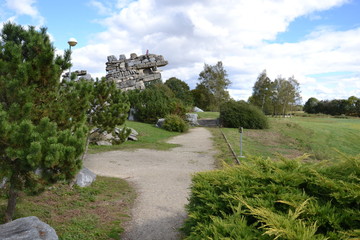 trees and artificial hills of stones in the Monument Tour de France, near the city of Tarbes