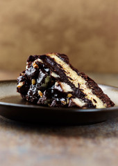 Piece of chocolate cake on rustic background. 