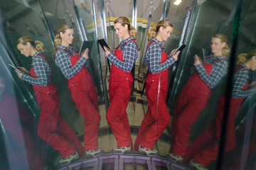 hard-working female engineer holding digital tablet