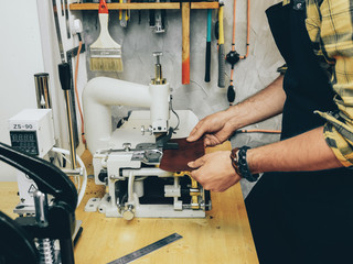 Work in leather workshop Close-up photo