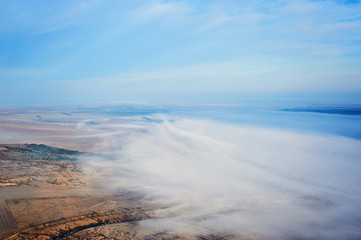 Fototapeta premium Aerial landscape. Fog above the fields