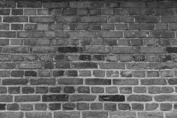 Dekorative alte Backsteinmauer in schwarz weiss