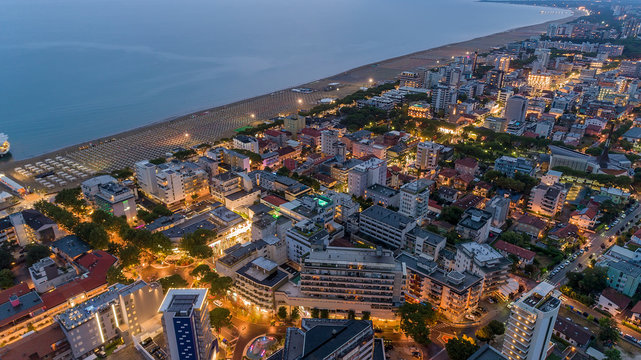 Lignano Sabbiadoro is town comune within province of Udine, in Friuli-Venezia Giulia region of north-eastern Italy. Summer resorts in northern Italy on Adriatic Sea coast. Beautiful night aerial view