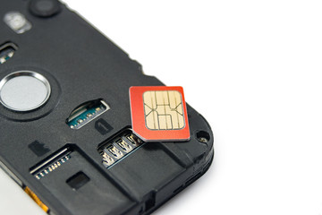 SIM card close-up next to the connector in the smartphone, phone