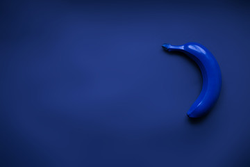 Pantone blue bananas on the darl blue navy background