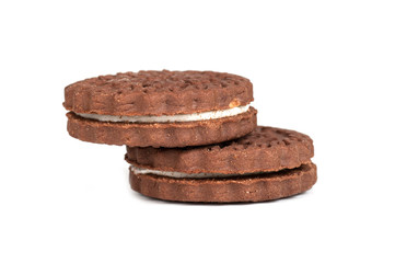 round chocolate chip cookies standing on top of each other isolated on white