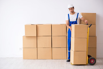 Young male professional mover doing home relocation