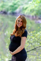 Fototapeta premium Maternity picture Young Redhead Mom