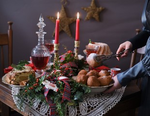 Decorated Christmas table with deep fried doughnut balls. Christmas in Holland.