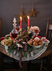 Decorated Christmas table with deep fried doughnut balls. Christmas in Holland.
