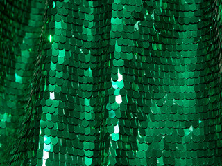 Spangle, sequin background. Shiny green mirror dress material cloth texture pattern