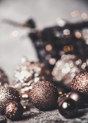 vintage christmas, new Year toys and decoration in basket on brown wooden table, copy space