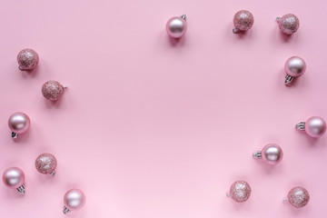 Christmas tree toys, flat lay. Festive New Year layout on pink background, top view, copy space.