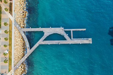 Aerial top view of wooden pier at Molos Promenade in Limassol, Cyprus.