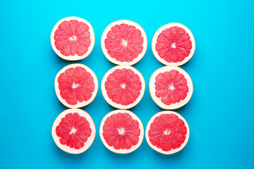 Fresh cut grapefruit on color background