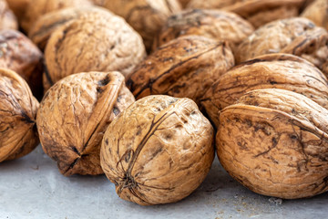 Walnuts with thick textured shells on the table