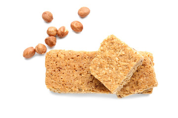 Tasty granola bars with nuts on white background