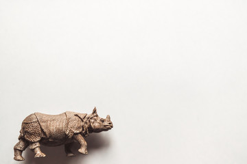A toy rhino isolated against a white background