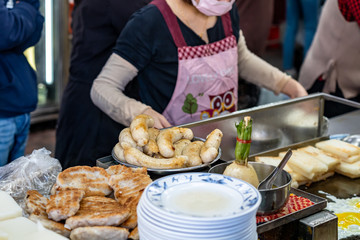 Local turnip cake vendor in Taichung Second Public Market. Old market has always been the favorite of backpack travellers, especially because of the food. Taichung, Taiwan