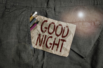 Word writing text Good Night. Business photo showcasing expressing good wishes on parting at night or before going to bed Writing equipment and brown note paper inside pocket of man work trousers