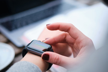 Close up woman hands using smartwatch