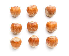 Tasty hazelnuts on white background
