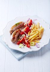 Grilled Sausages with tomatoes and french fries