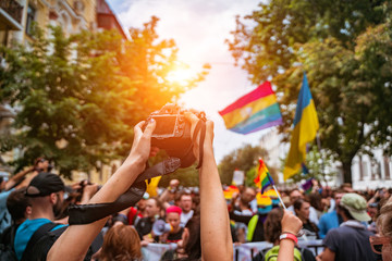 Fototapeta na wymiar Correspondent takes photo during the Gay Pride parade