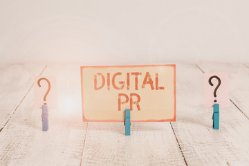 Text sign showing Digital Pr. Business photo text marketing strategy used to increase their online presence Scribbled and crumbling sheet with paper clips placed on the wooden table
