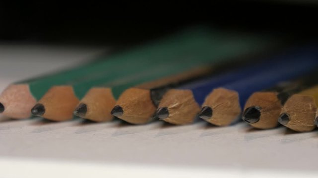 Several pencils aligned macro 4k