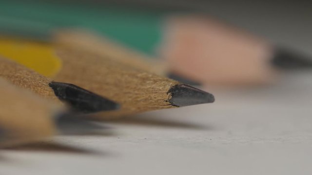 Several pencils aligned macro 4k