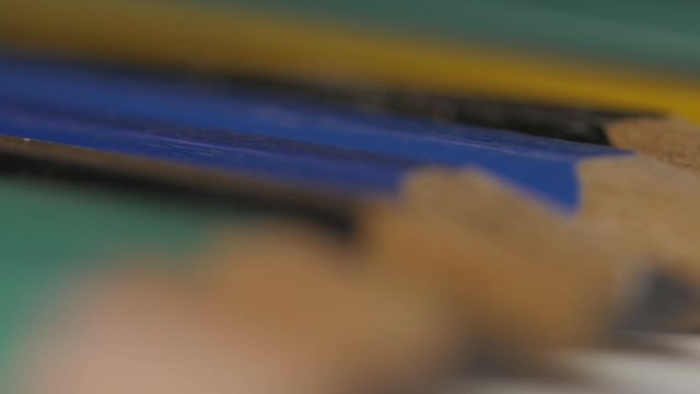 Several pencils aligned macro 4k