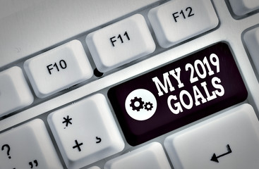 Handwriting text My 2019 Goals. Conceptual photo setting up demonstratingal goals or plans for the current year White pc keyboard with empty note paper above white background key copy space