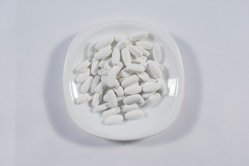 Pharmacy theme, white medicine tablets antibiotic pills.