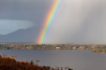 Fototapeta premium Rainbow and Rain Clouds over Caragh Lake in County Kerry, Ireland